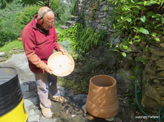bottom removed from large flower pot