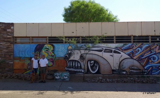 ellie-and-louis-in-front-of-mural